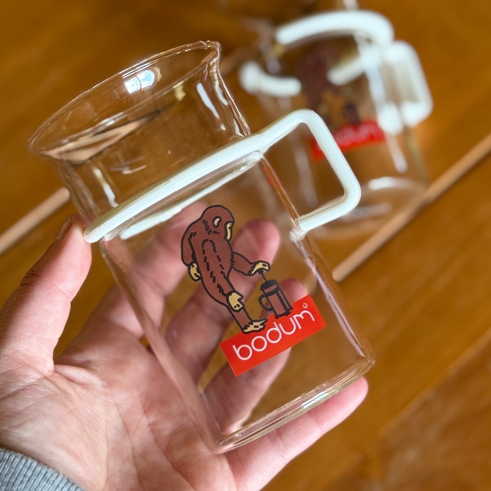 X2 Bodum Clear Glass Mugs with White Handles and Monkey Design